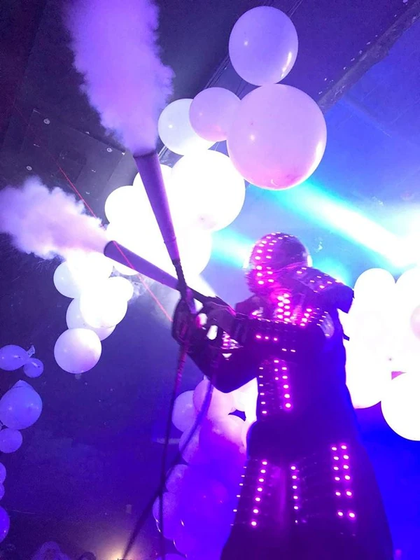 LED Robot stilt performer engaging crowd at party
