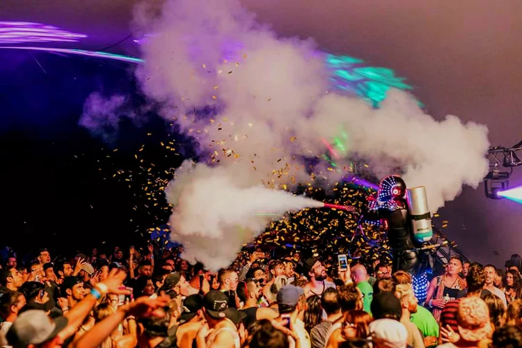 LED Robot stilt performer with full-colour programmable lights at nightclub event