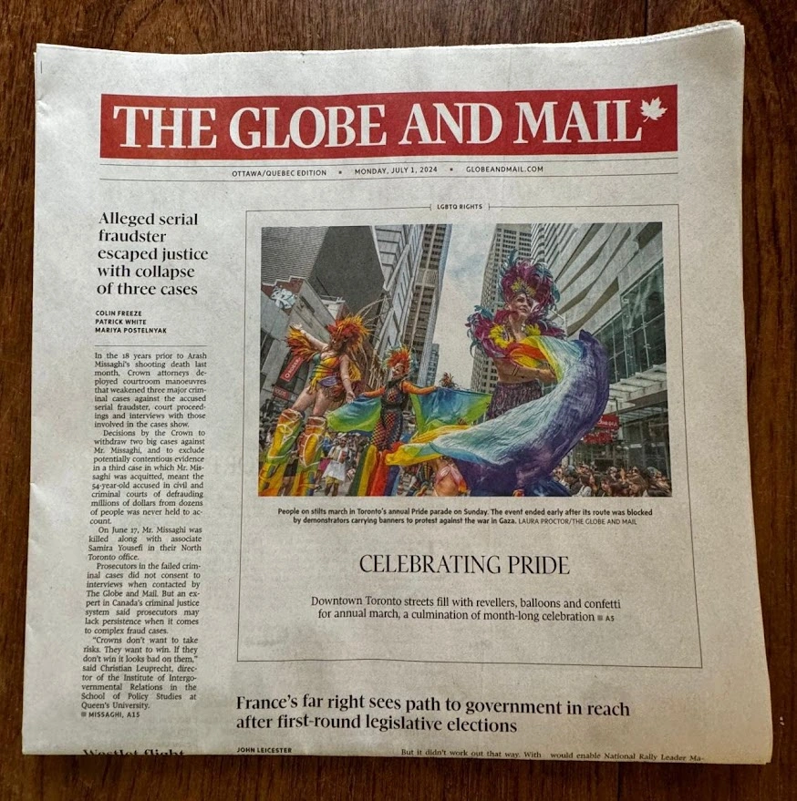 Globe and Mail front page featuring Hala Circus Arts Pride stilt-walkers at Toronto Pride Parade, headline: Celebrating Pride