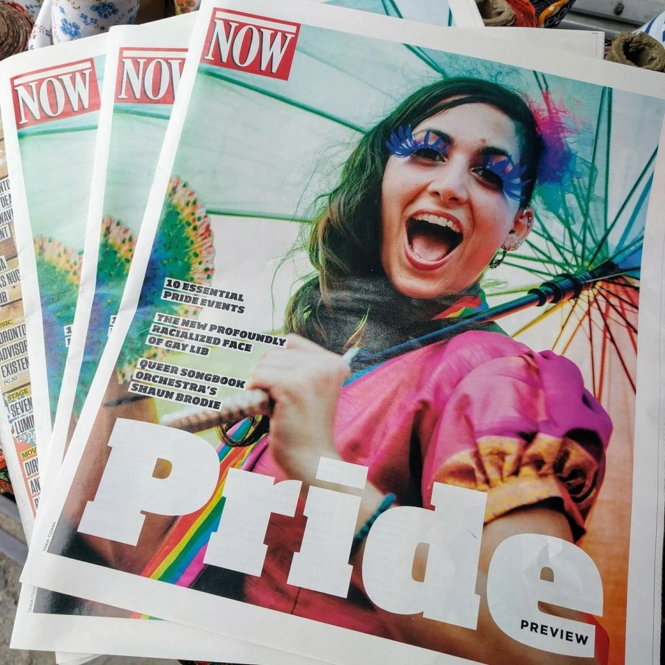 News cover featuring Hala Circus Arts Pride performers at community celebration