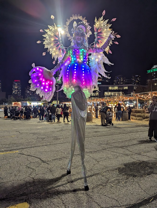 Hala on stilts circus entertainment Toronto events LED Stilt-walkers Luminous performers glow show