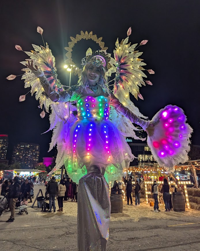 Hala on stilts circus entertainment Toronto events LED Stilt-walkers Luminous performers glow show