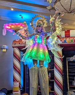 Hala on stilts circus entertainment Toronto events LED Stilt-walkers Luminous performers glow show