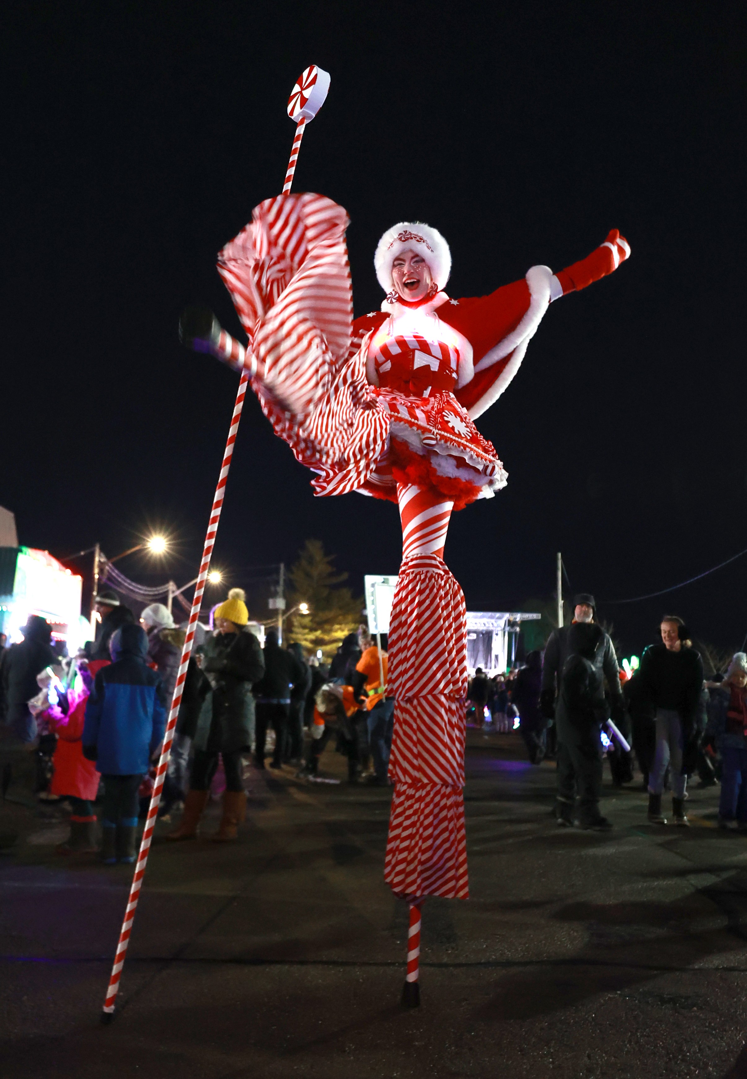 Hire circus performers Toronto Hala on stilts event Entertainment stiltwalkers Christmas peppermint peppermintina red and white