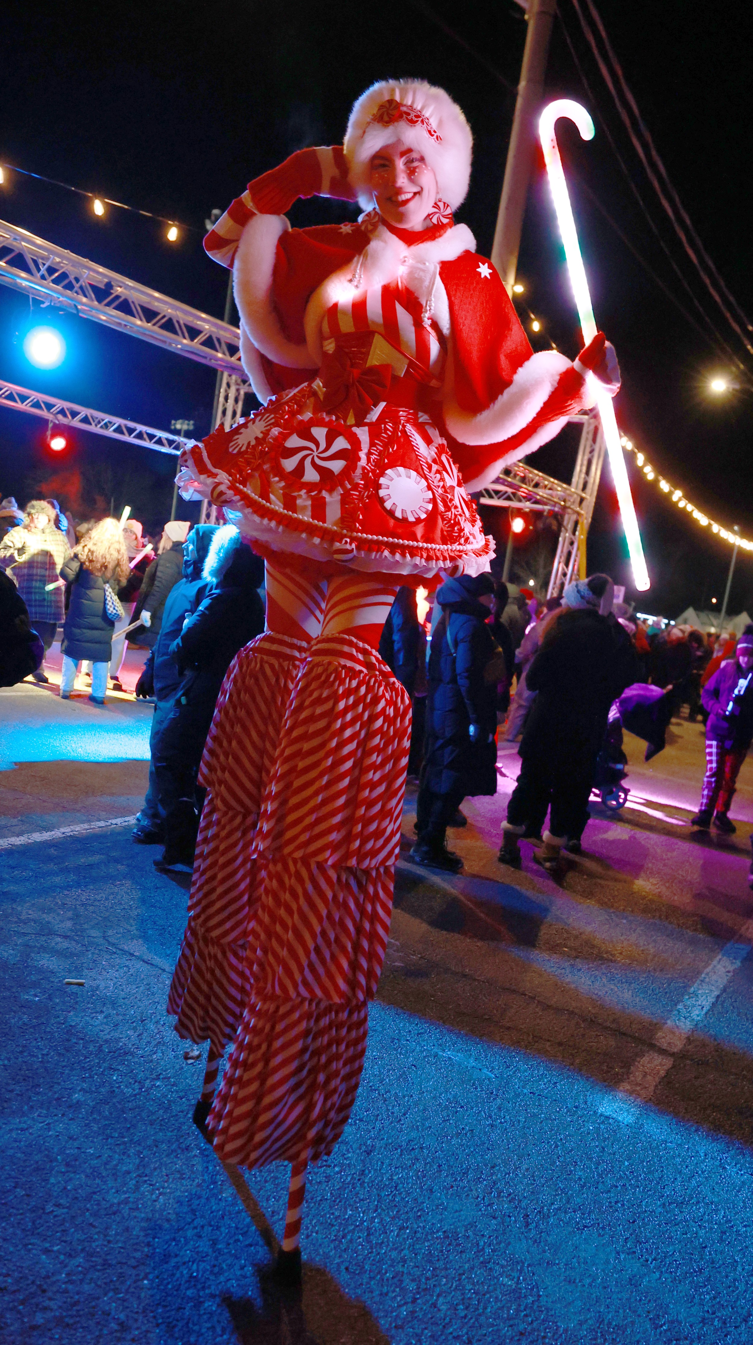 Hire circus performers Toronto Hala on stilts event Entertainment stiltwalkers Christmas peppermint peppermintina red and white