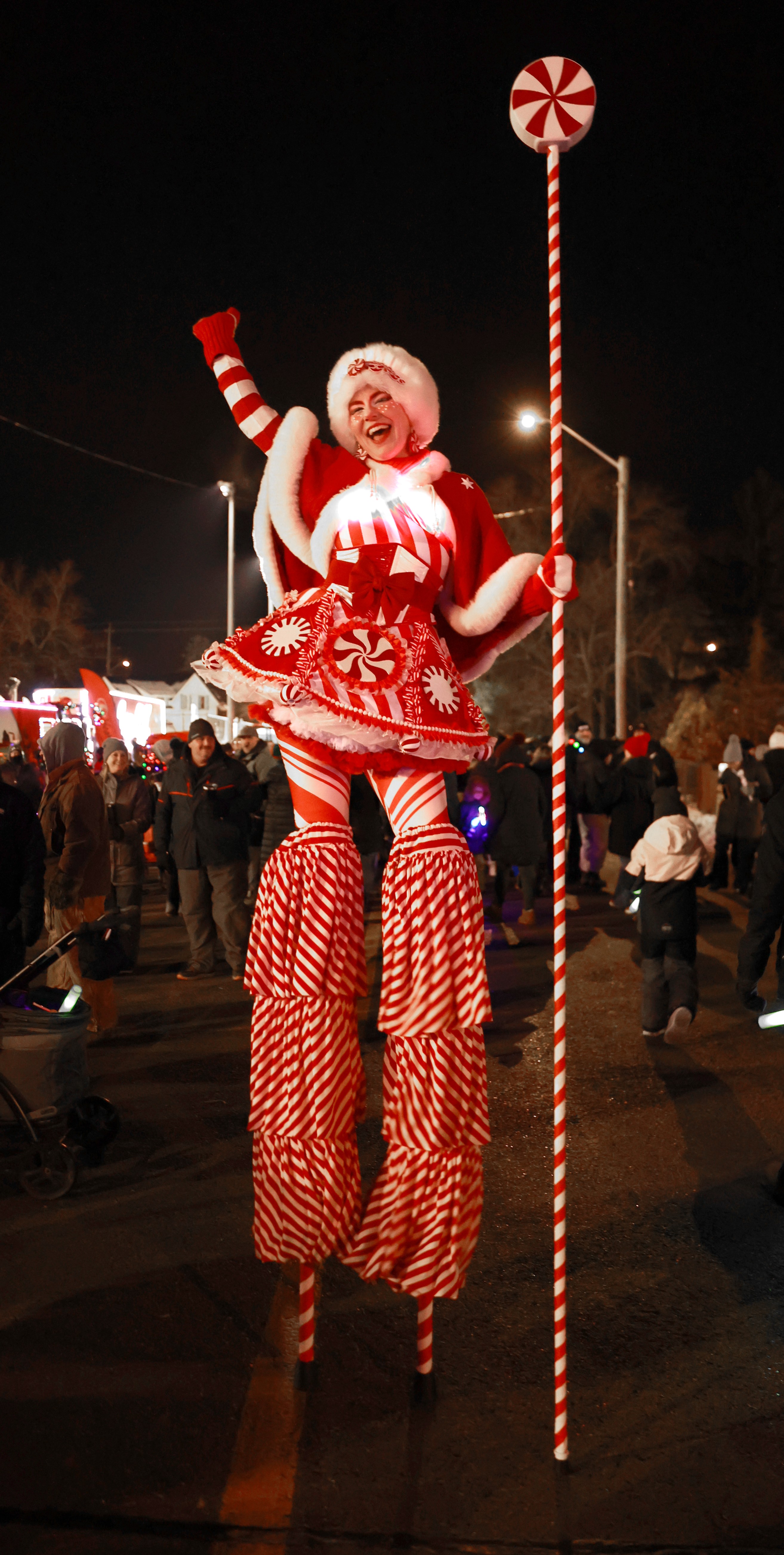 Hire circus performers Toronto Hala on stilts event Entertainment stiltwalkers Christmas peppermint peppermintina red and white